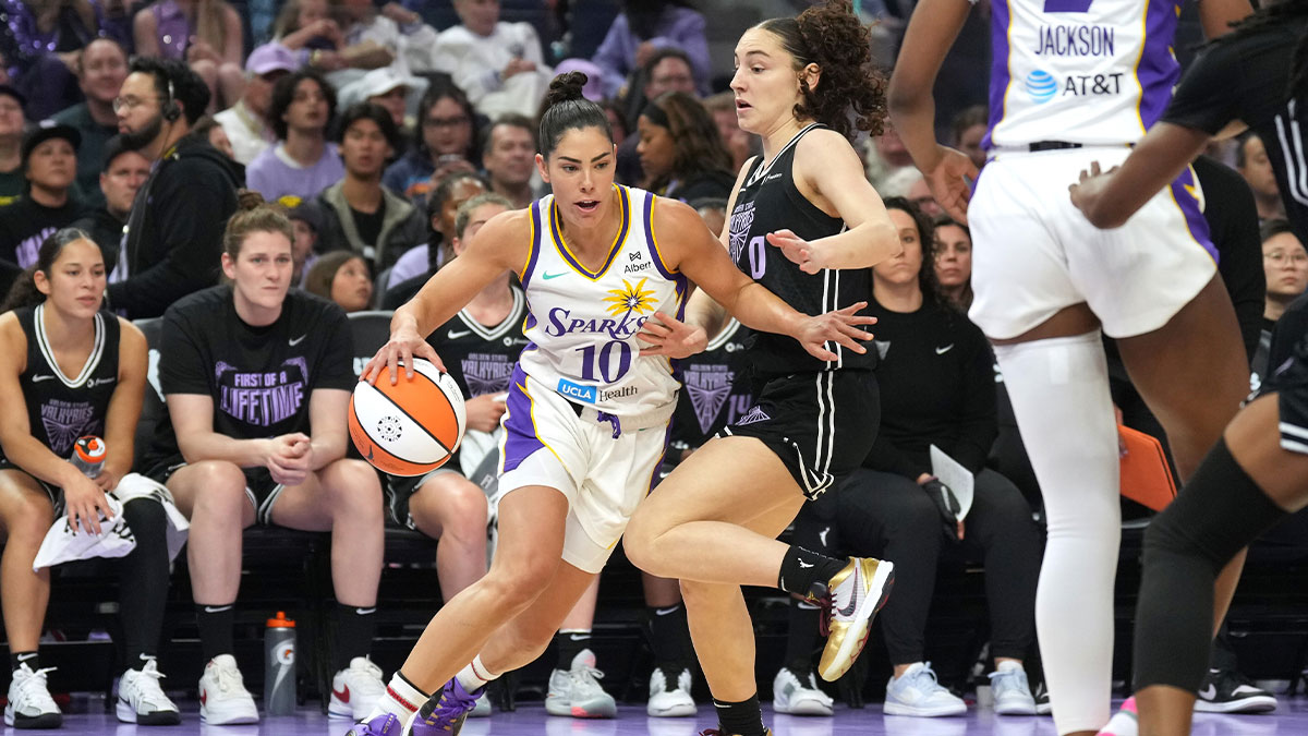 Los Angeles Sparks guard Kelsey Plum (10) dribbles against Golden State Valkyries guard Carla Leite (center right) during the first quarter at Chase Center.