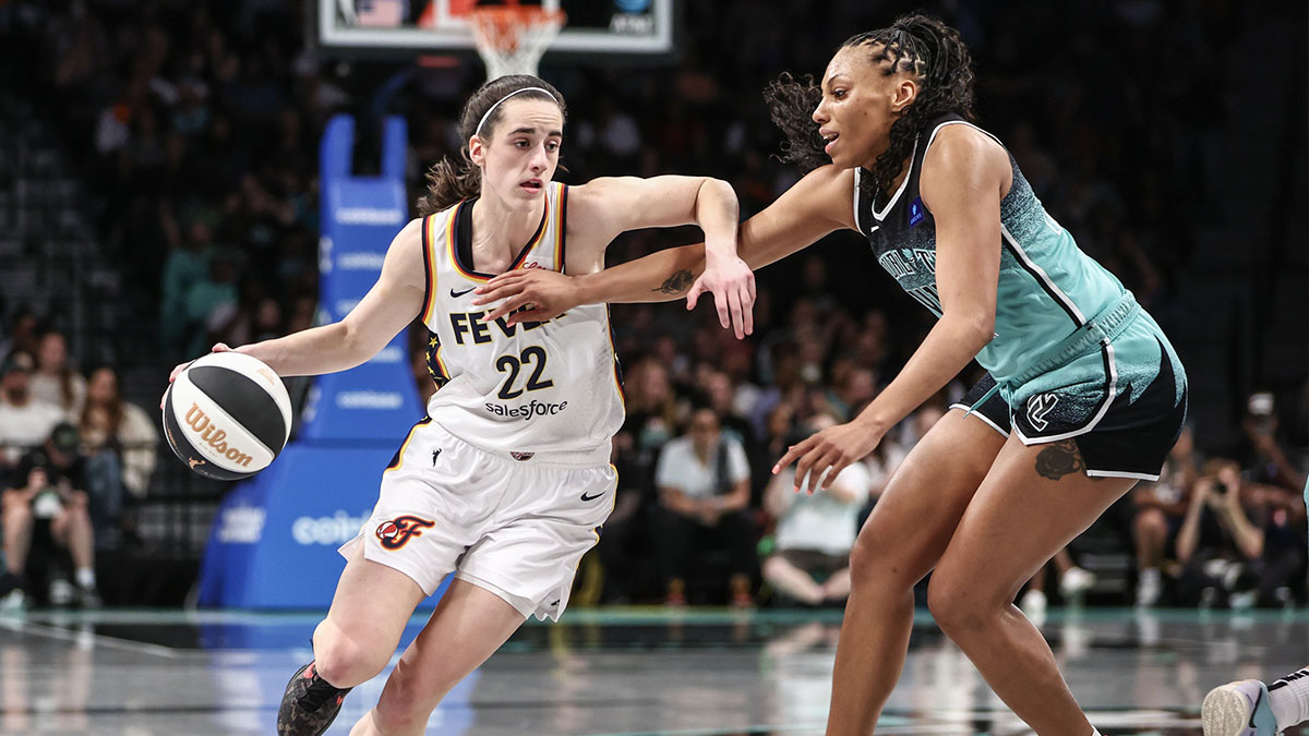 Indiana Fever guard Caitlin Clark (22) looks to drive past New York Liberty forward Betnijah Laney-Hamilton (44) at Barclays Center.