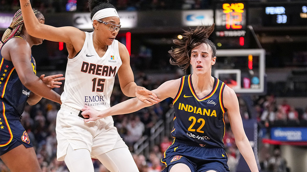 Indiana Fever guard Caitlin Clark (22) rushes up the court against Atlanta Dream guard Allisha Gray (15) on Thursday, May 9, 2024, during the preseason game against the Atlanta Dream at Gainbridge Fieldhouse in Indianapolis.