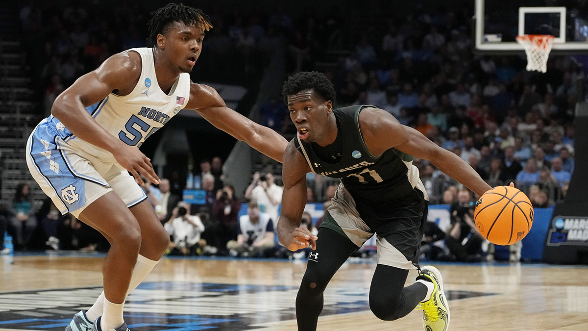 Wagner Seahawks guard Melvin Council Jr. (11) drives against North Carolina Tar Heels forward Harrison Ingram (55) in the first round of the 2024 NCAA Tournament at the Spectrum Center.