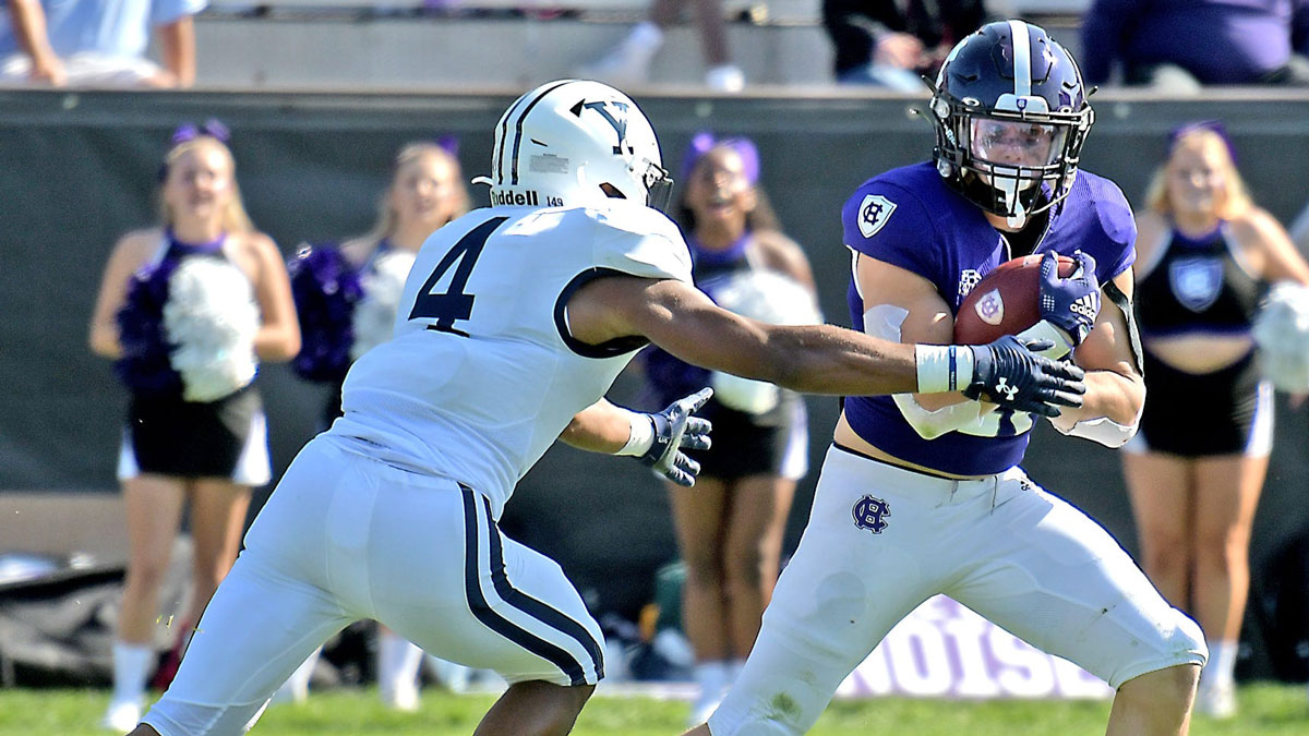 Holy Cross receiver Tyler Purdy breaks away from Yale's Wande Owens for a 36-yard touchdown.