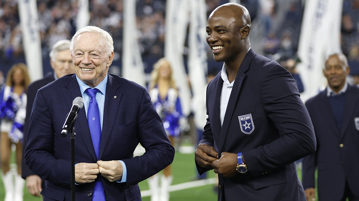 Oct 29, 2023; Arlington, Texas, USA; Dallas Cowboys owner Jerry Jones and former player DeMarcus Ware smile during the induction ceremony for the Ring of Honor during half time in the game against the Los Angeles Rams at AT&T Stadium. Mandatory Credit: Tim Heitman-Imagn Images
