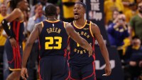 Golden State Warriors forward Draymond Green (23) celebrates with forward Jimmy Butler III (10) after a play against the Houston Rockets during the fourth quarter of game four of the 2025 NBA Playoffs first round at Chase Center.