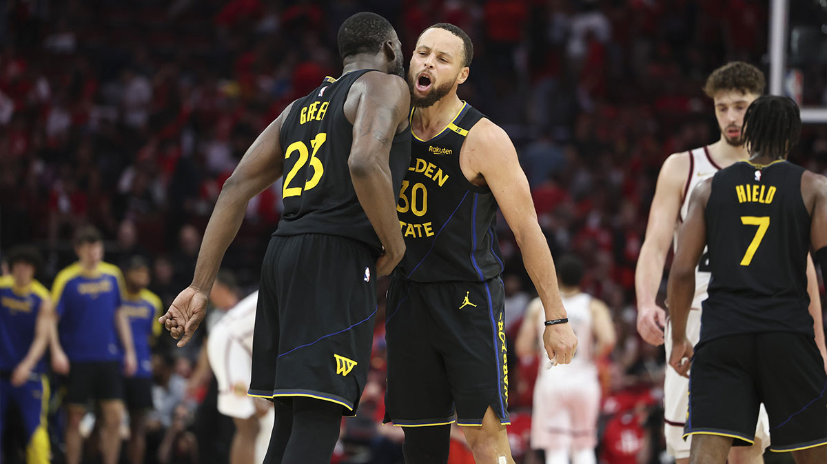 Golden State Warriors guard Stephen Curry (30) celebrates with forward Draymond Green (23) after a play during game seven of the first round for the 2025 NBA Playoffs against the Houston Rockets at Toyota Center.