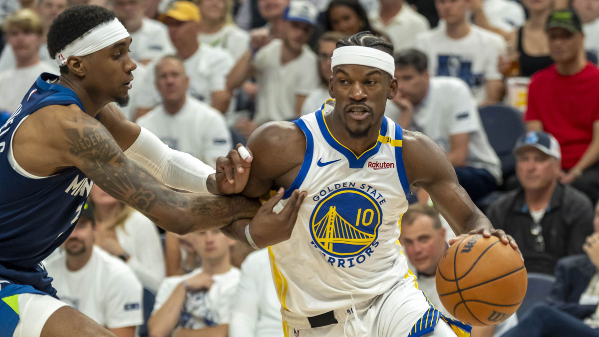 Warriors forward Jimmy Butler III (10) drives to the basket past Minnesota Timberwolves forward Jaden McDaniels (3) in the second half during game five of the second round for the 2025 NBA Playoffs at Target Center