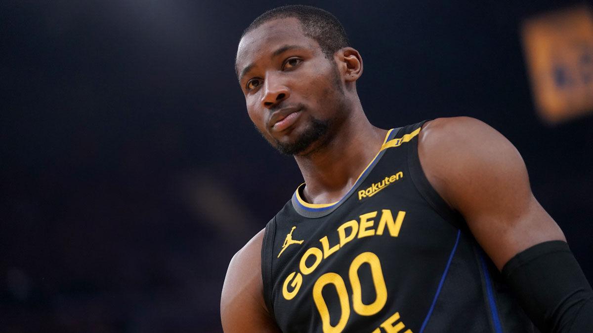 Warriors forward Jonathan Kuminga (00) stands on the court during warmups against the Minnesota Timberwolves during game four of the second round for the 2025 NBA Playoffs at Chase Center with the Bulls logo in the background