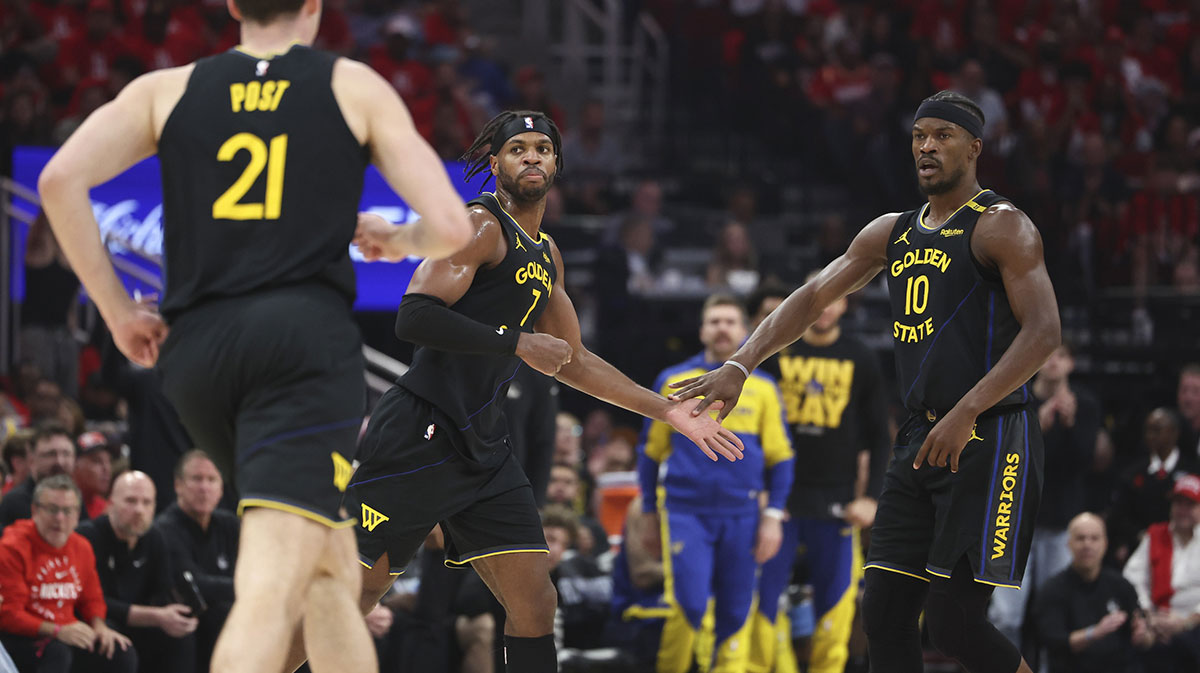 Warriors guard Buddy Hield (7) celebrates with forward Jimmy Butler III