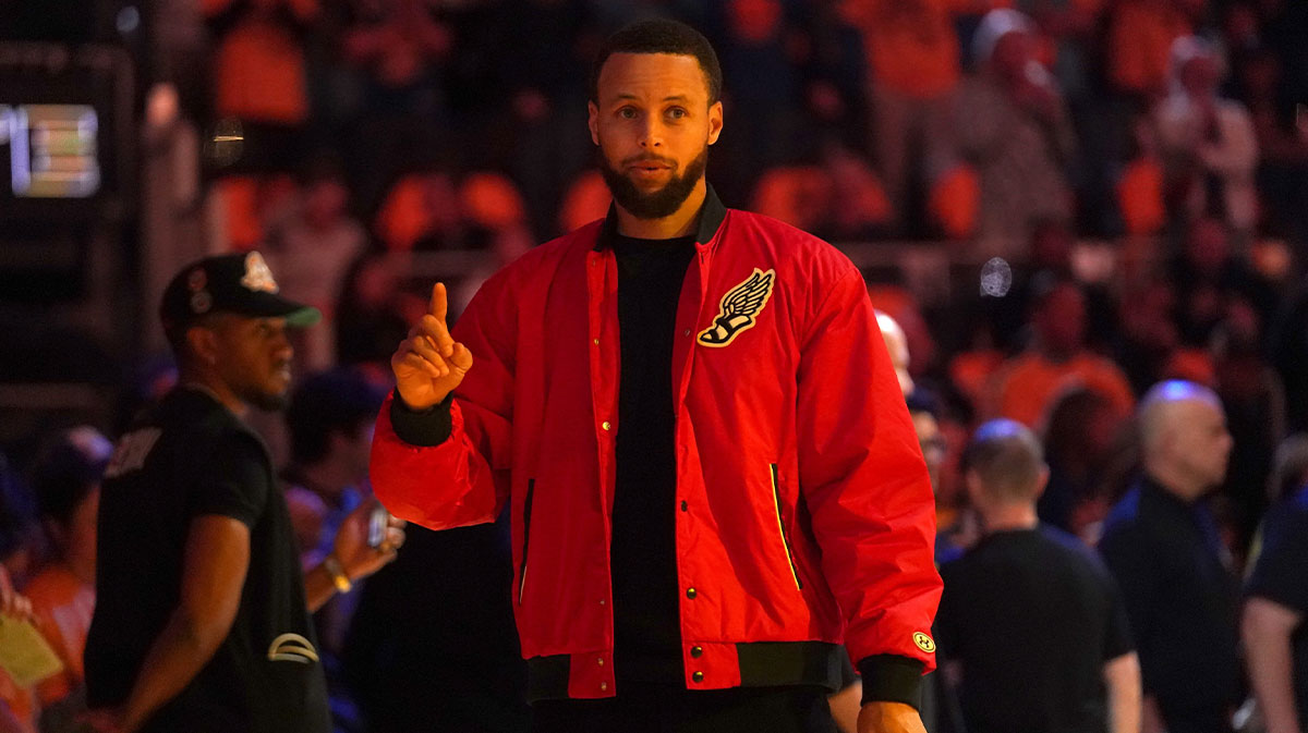 Warriors guard Stephen Curry stands on the court before the start of the game