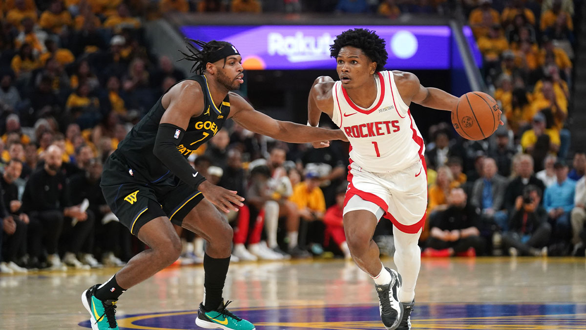 Houston Rockets forward Amen Thompson (1) dribbles past Golden State Warriors guard Buddy Hield (7) in the second quarter of game six of the first round for the 2025 NBA Playoffs at Chase Center.