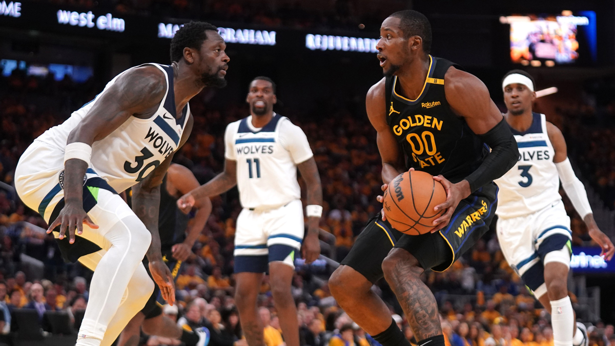 Golden State Warriors forward Jonathan Kuminga (00) holds onto the ball next to Minnesota Timberwolves forward Julius Randle (30) in the third quarter during game four of the second round for the 2025 NBA Playoffs at Chase Center.