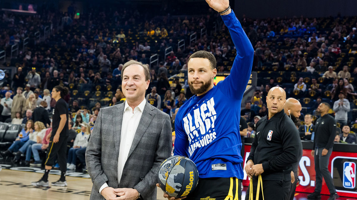 Golden State Warriors CEO Joe Lacob presents guard Stephen Curry (30) with the 2024 NBA All-Star ball before the game against the Phoenix Suns at Chase Center.