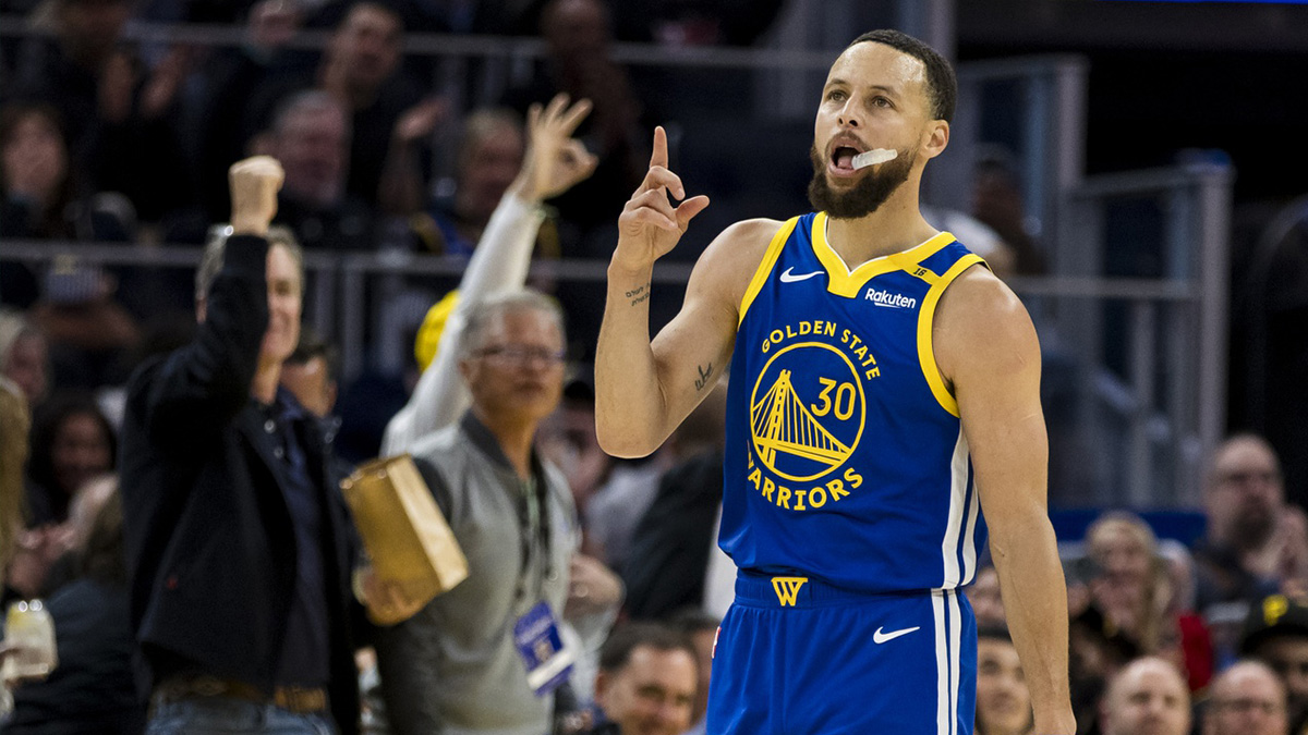 Golden State Warriors guard Stephen Curry (30) reacts after hitting a three-point shot against the Portland Trail Blazers during the third quarter at Chase Center.