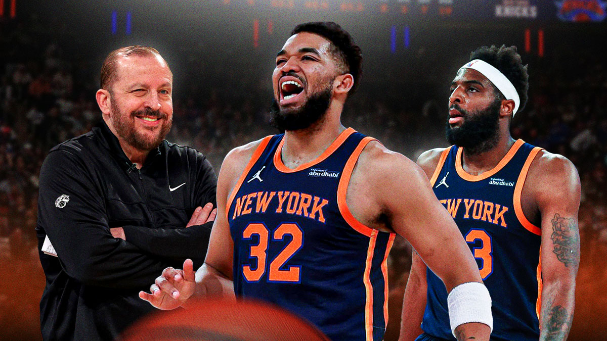 Karl-Anthony Towns yelling in celebration with Mitchell Robinson and Tom Thibodeau grinning