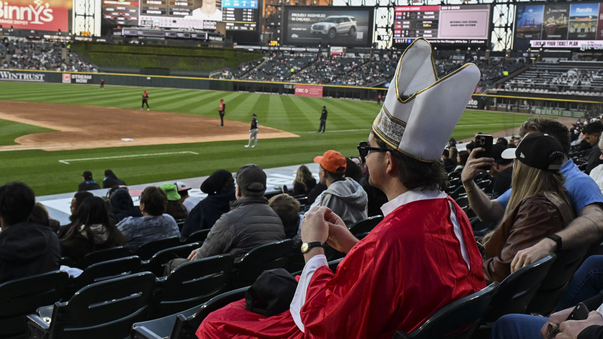 David Hughes form Chicago watches the game between the Miami Marlins and the Chicago White Sox while dressed as the Pope during the fourth inning at Rate Field.