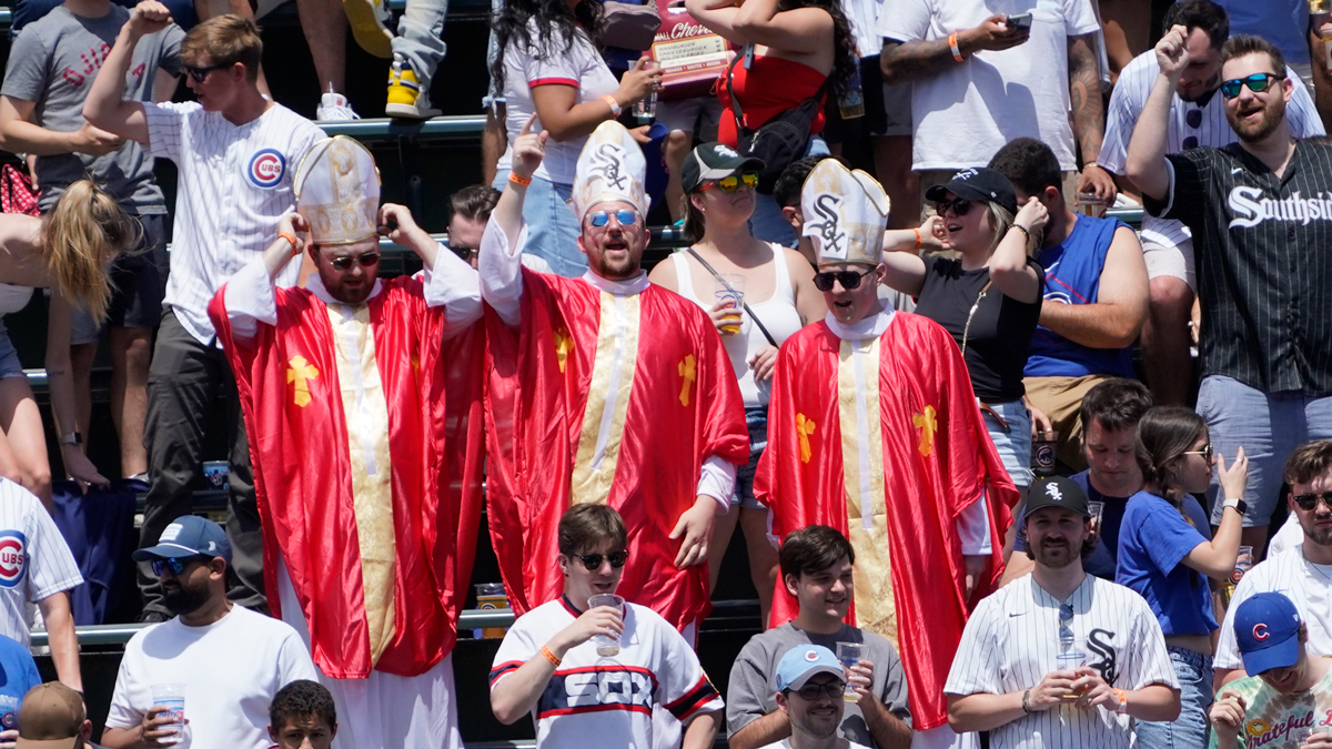 Chicago White Sox fans dressed like Pope Leo XIV in the bleachers during a game between the Chicago Cubs and the Chicago White Sox at Wrigley Field