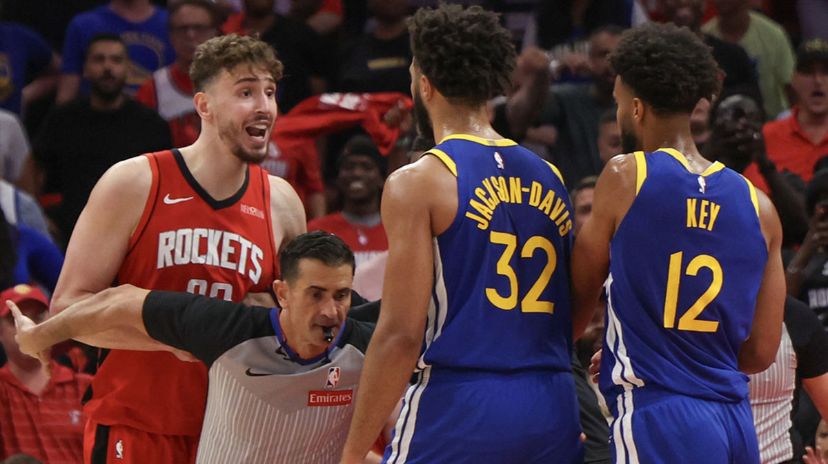Houston Rockets center Alperen Sengun (28) argues with Golden State Warriors forward Trayce Jackson-Davis (32) in the fourth quarter during game five of first round for the 2025 NBA Playoffs at Toyota Center.
