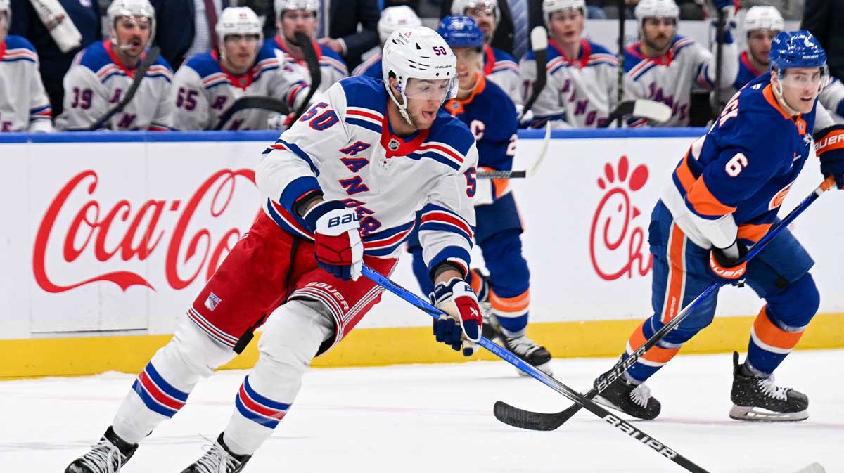 New York Rangers left wing Will Cuylle (50) skates across the blue line against the New York Islanders during the first period at UBS Arena.