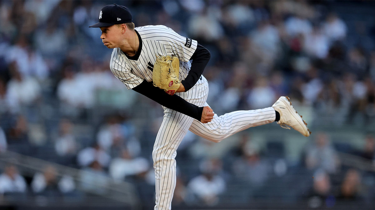 New York Yankees starting pitcher Will Warren (98) follows through on a pitch against the Texas Rangers during the first inning at Yankee Stadium