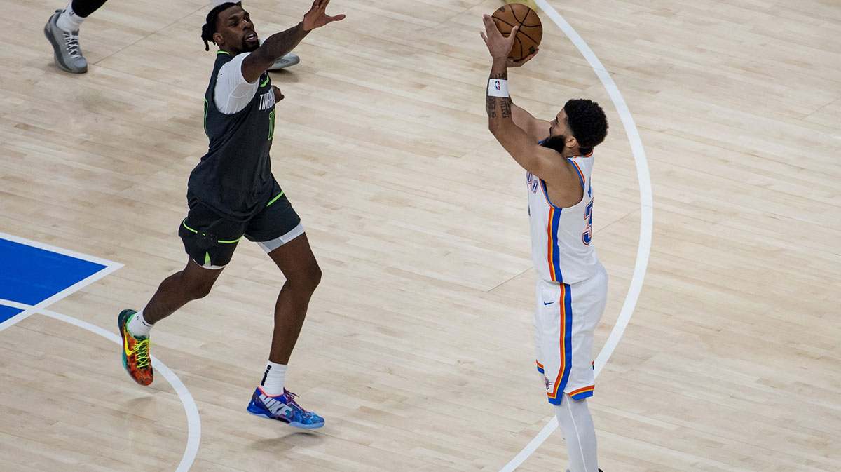 Oklahoma City Thunder forward Kenrich Williams (34) shoots against Minnesota Timberwolves center Naz Reid (11) in the third quarter during game one of the western conference finals for the 2025 NBA Playoffs at Paycom Center.