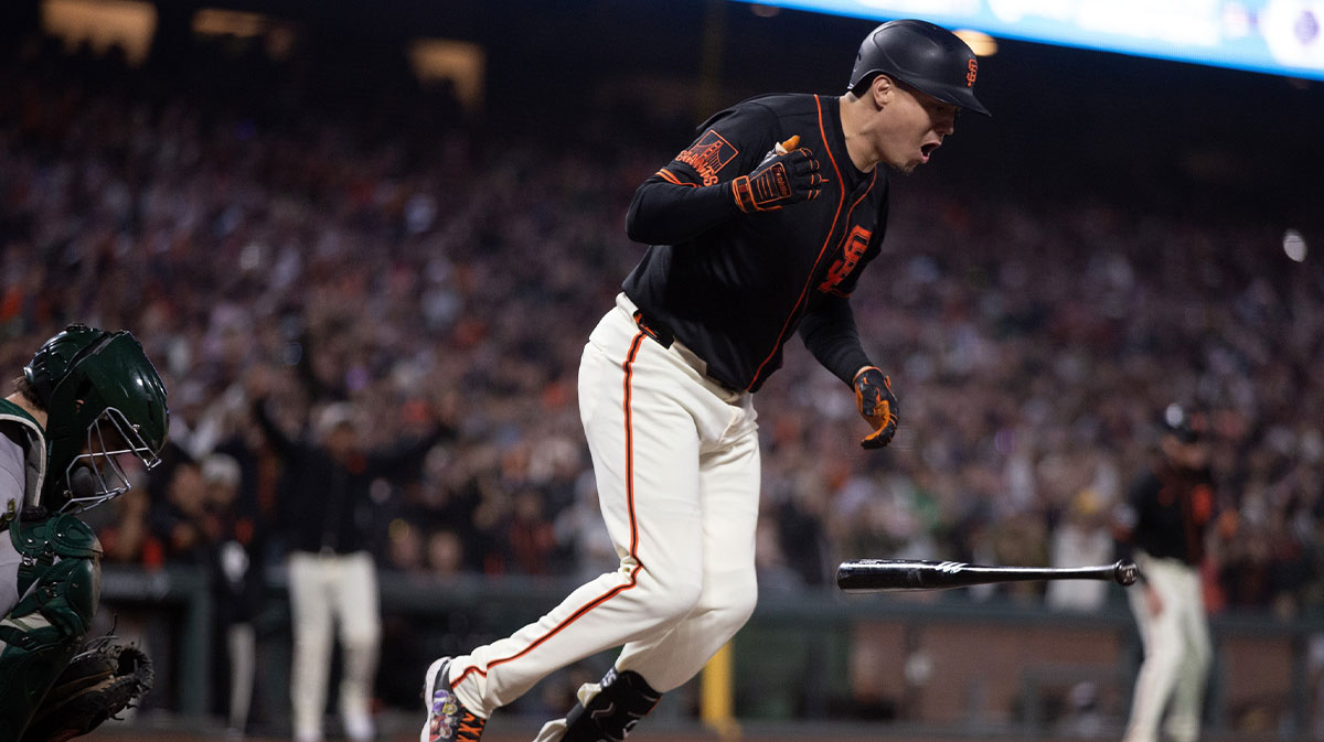 San Francisco Giants designated hitter Wilmer Flores (41) reacts to earning a bases-loaded walk to force in the winning run against the Athletics during the tenth inning at Oracle Park.