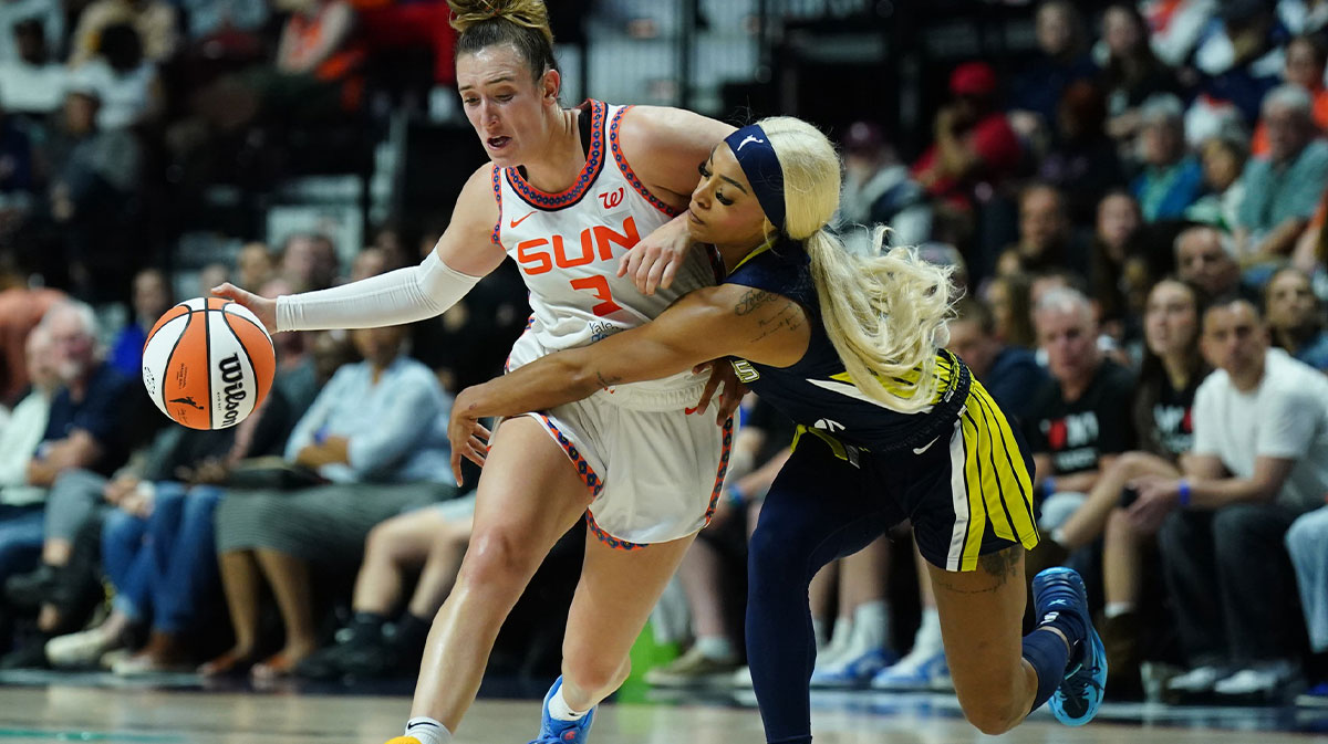Dallas Wings guard DiJonai Carrington (21) defends against Connecticut Sun guard Marina Mabrey (3) in the second half at Mohegan Sun Arena.