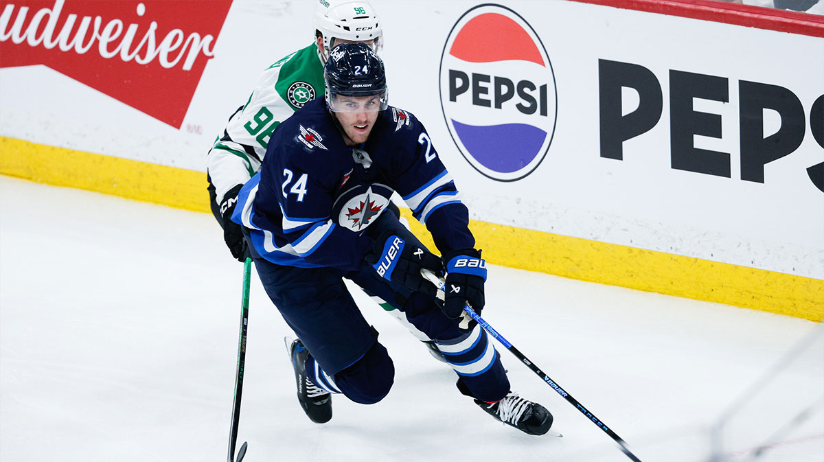 Winnipeg Jets defenseman Hayden Fleury (24) skates away from Dallas Stars forward Mikko Rantanen (96) during the third period in game one of the second round of the 2025 Stanley Cup Playoffs at Canada Life Centre.
