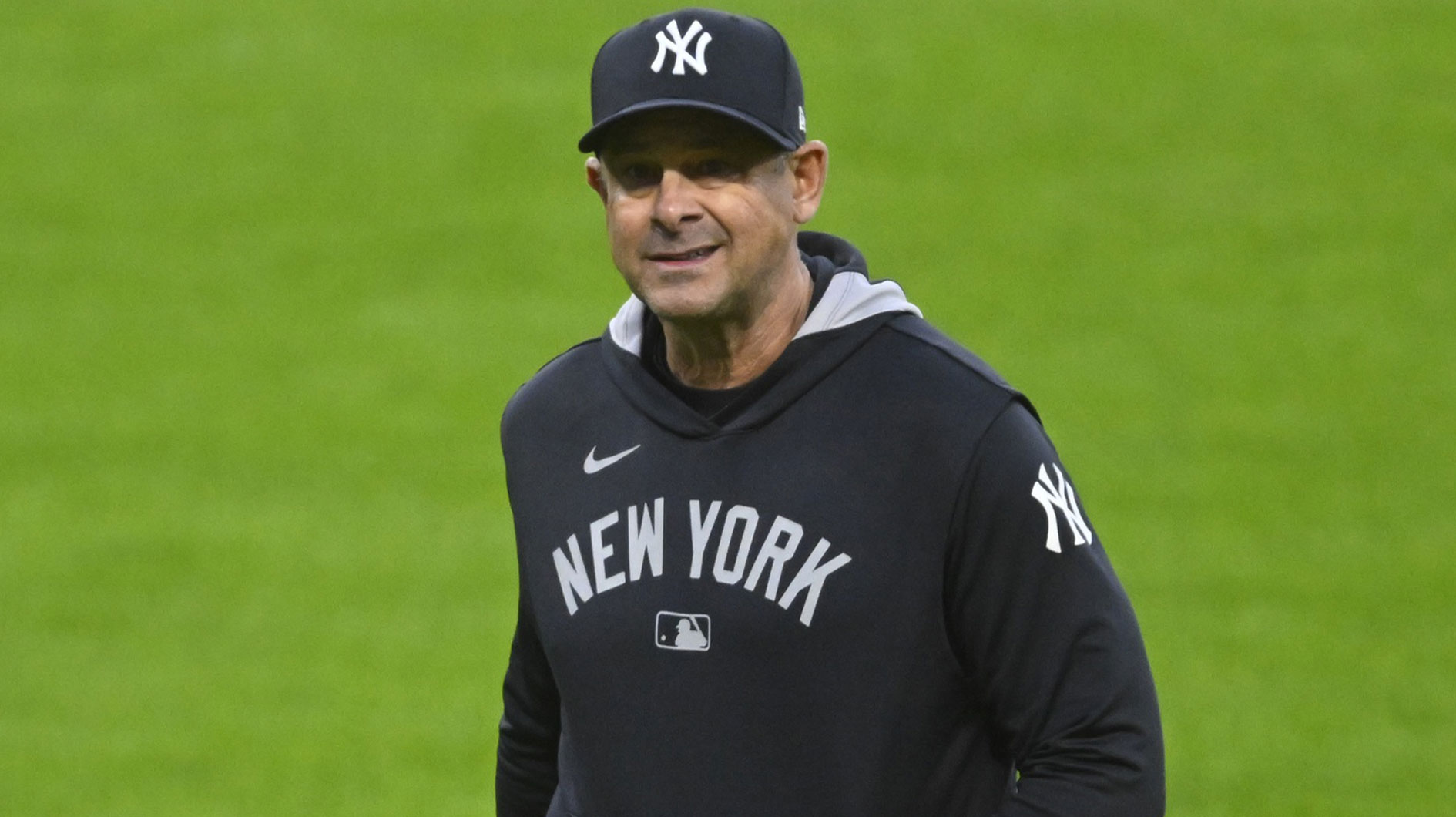 New York Yankees manager Aaron Boone (17) walks on the field during a pitching change in the sixth inning against the Cleveland Guardians at Progressive Field