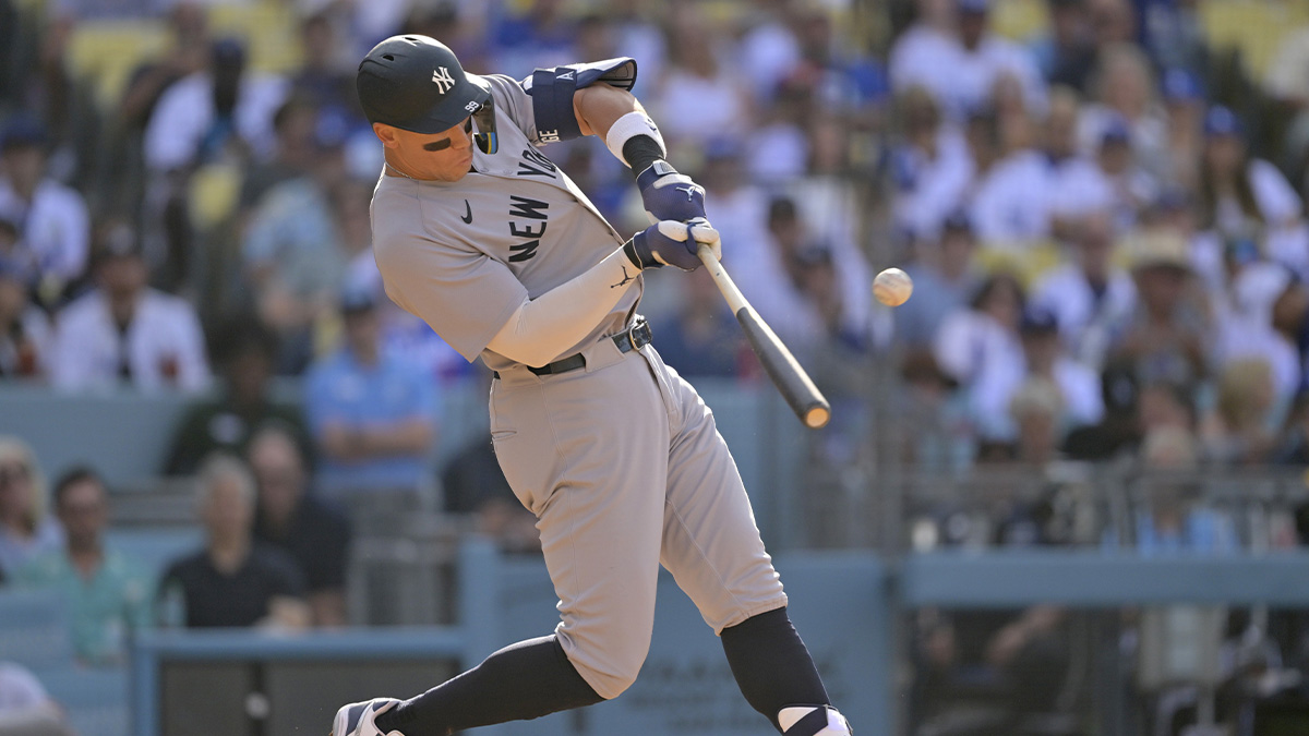 New York Yankees outfielder Aaron Judge (99) hits a solo home run in the fourth inning against the Los Angeles Dodgers at Dodger Stadium.