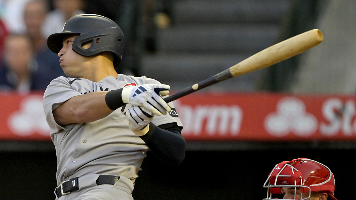 New York Yankees shortstop Anthony Volpe (11) doubles in three runs in the fourth inning against the Los Angeles Angels at Angel Stadium.