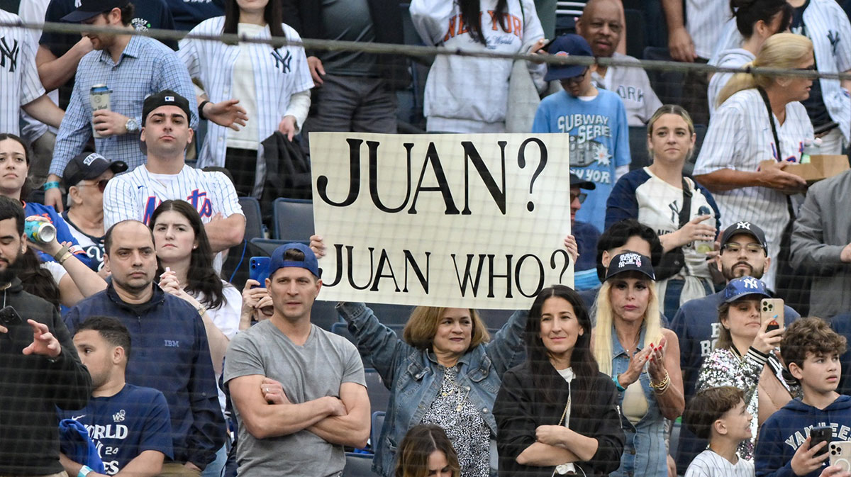 A fan holds a sign during a first inning at bat against the New York Yankees by New York Mets outfielder Juan Soto (not pictured) at Yankee Stadium.