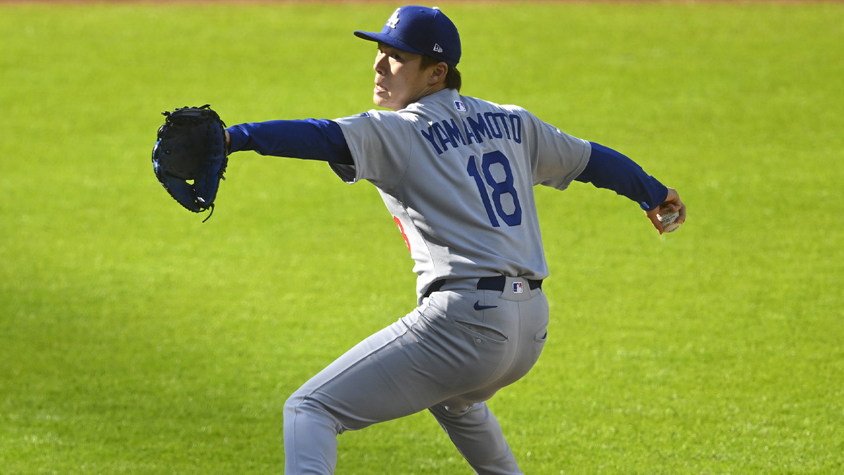May 26, 2025; Cleveland, Ohio, USA; Los Angeles Dodgers starting pitcher Yoshinobu Yamamoto (18) delivers a pitch in the first inning against the Cleveland Guardians at Progressive Field.
