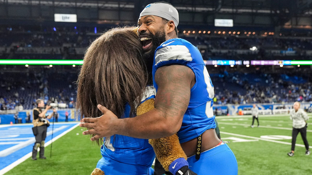 Detroit Lions defensive end Za'Darius Smith hugs mascot Roary to celebrate the 52-6 win over the Jacksonville Jaguars at Ford Field in Detroit on Sunday, Nov. 17, 2024.