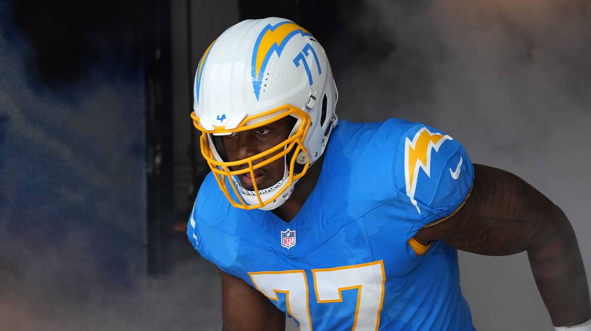 Sep 8, 2024; Inglewood, California, USA; Los Angeles Chargers guard Zion Johnson (77) enters the field before the game against the Las Vegas Raiders at SoFi Stadium. Mandatory Credit: Kirby Lee-Imagn Images.