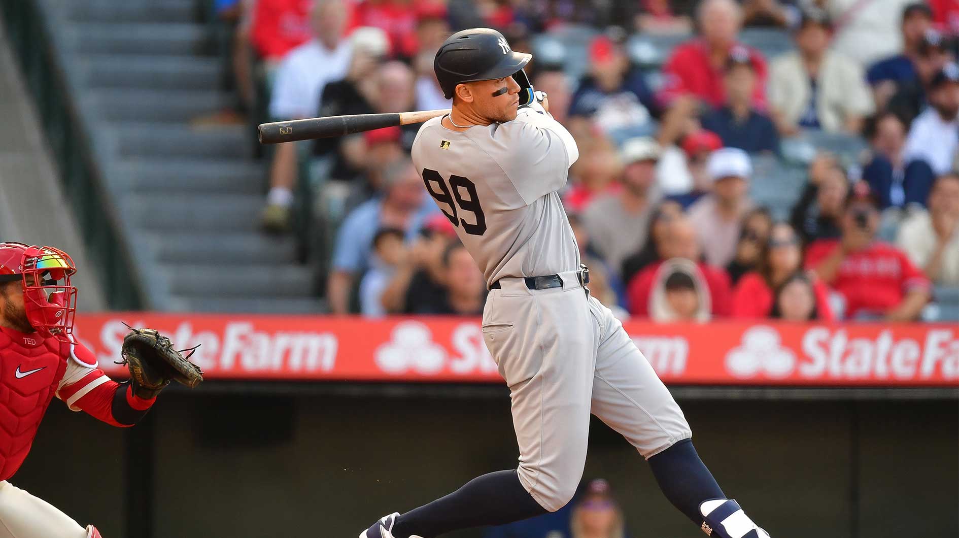 Yankees right fielder Aaron Judge (99) hits a single against the Los Angeles Angels during the first inning.