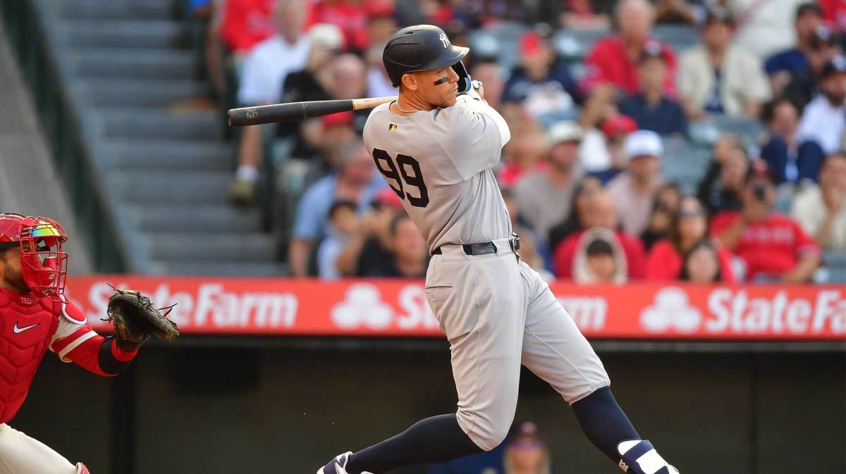 Yankees right fielder Aaron Judge (99) hits a single against the Los Angeles Angels during the first inning.