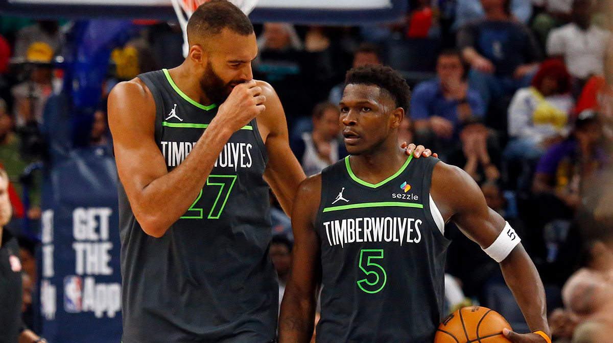 Minnesota Timberwolves center Rudy Gobert (27) talks with guard Anthony Edwards (5) during a time out during the fourth quarter against the Memphis Grizzlies at FedExForum.