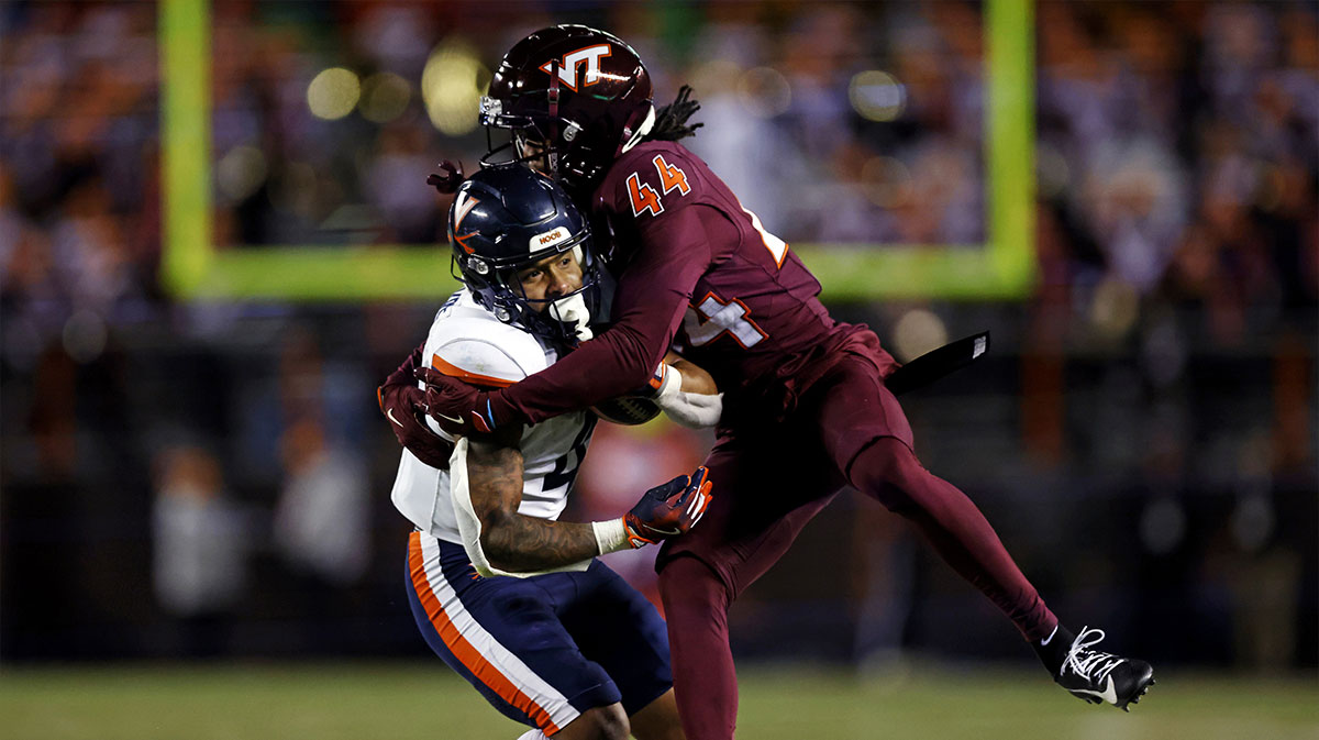 Virginia Tech Hokies cornerback and Bills 2025 NFL Draft pick Dorian Strong (44) tackles Virginia Cavaliers wide receiver Chris Tyree (4) during the fourth quarter at Lane Stadium.