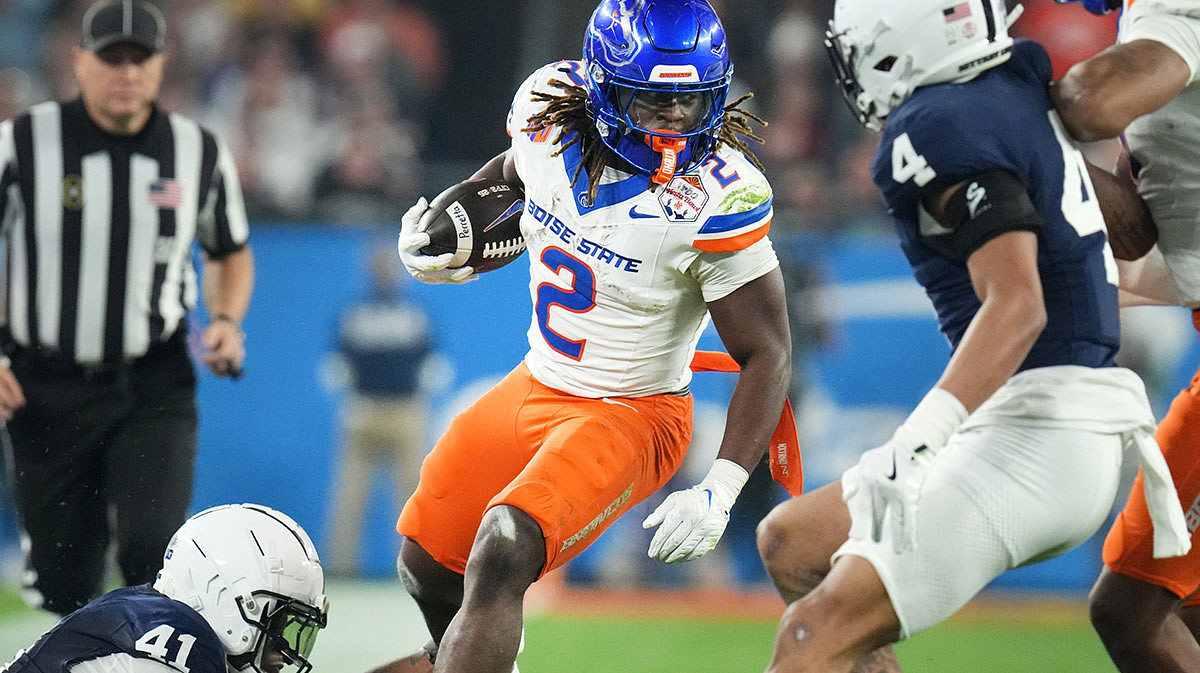 LAS VEGAS RAIDERS: Boise State Broncos running back Ashton Jeanty (2) runs past Penn State Nittany Lions linebacker Kobe King (41) during their Vrbo Fiesta Bowl matchup at State Farm Stadium on Dec. 31, 2024.