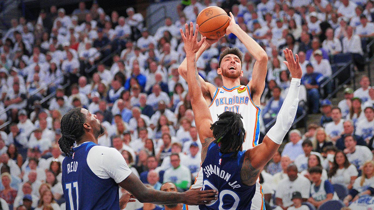 Oklahoma City Thunder forward Chet Holmgren (7) shoots the ball over Minnesota Timberwolves guard Terrence Shannon Jr. (00) during the first half in game three of the western conference finals for the 2025 NBA Playoffs at Target Center.