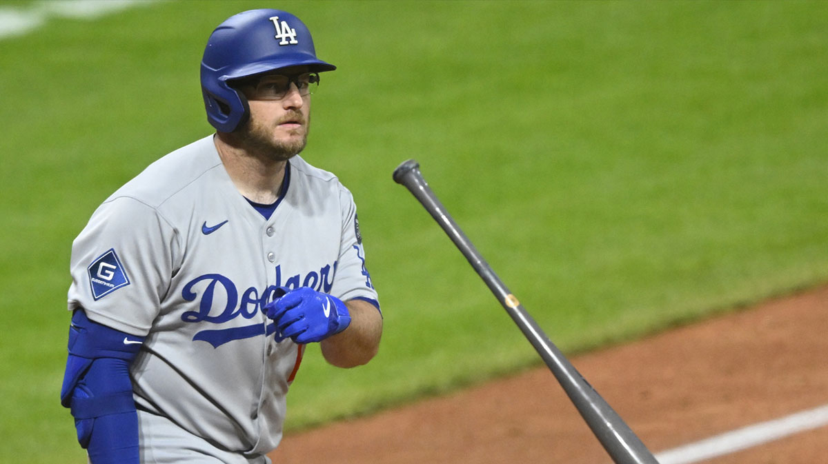 Los Angeles Dodgers third baseman Max Muncy (13) tosses his bat after hitting a three-run home run in the ninth inning against the Cleveland Guardians at Progressive Field.