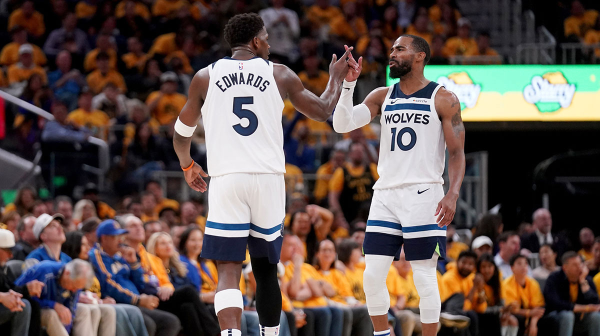 Minnesota Timberwolves guard Mike Conley (10) and guard Anthony Edwards (5) celebrate after the Timberwolves made a basket against the Golden State Warriors in the third quarter during game four of the second round for the 2025 NBA Playoffs at Chase Center.