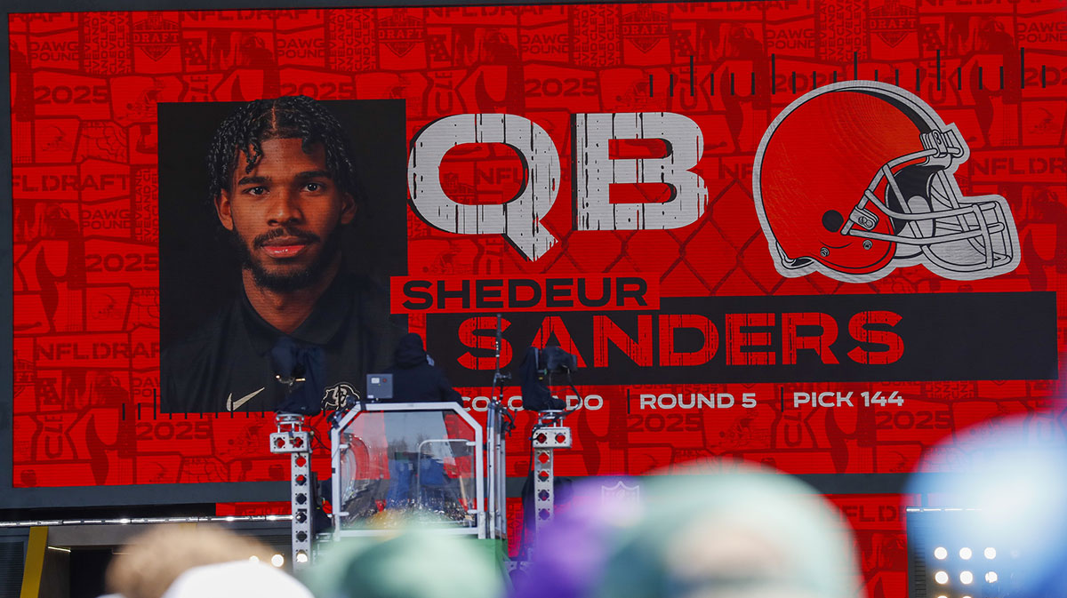 A graphic announcing Colorado quarterback Shedeur Sanders’ selection by the Cleveland Browns with the 144th overall pick is seen in the Draft Theater during the third day of the 2025 NFL Draft at Lambeau Field.