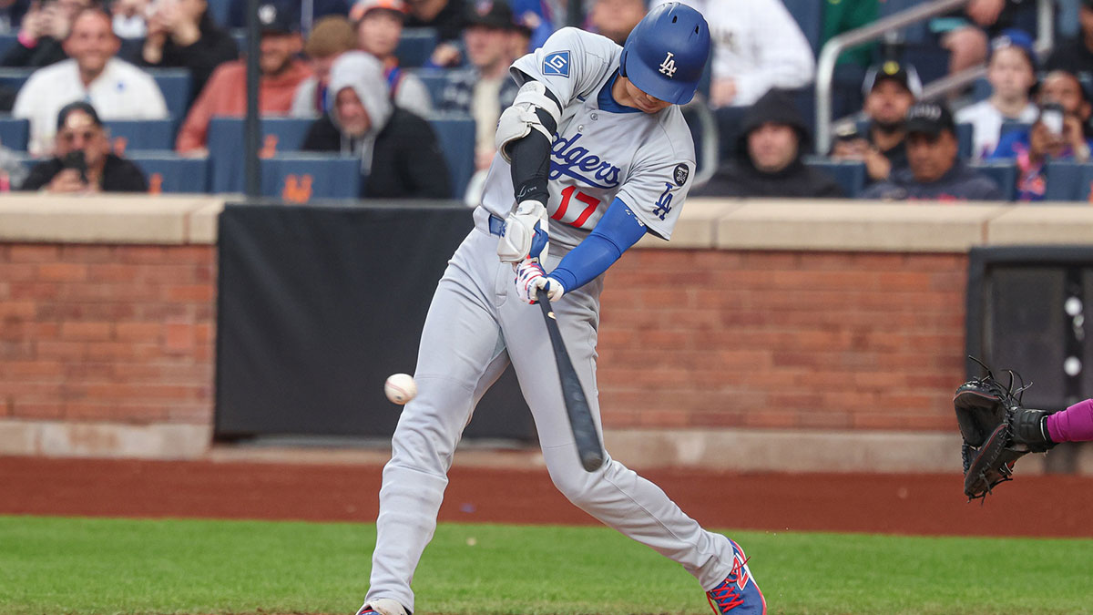 Los Angeles Dodgers designated hitter Shohei Ohtani (17) hits a solo home run during the first inning against the New York Mets at Citi Field.