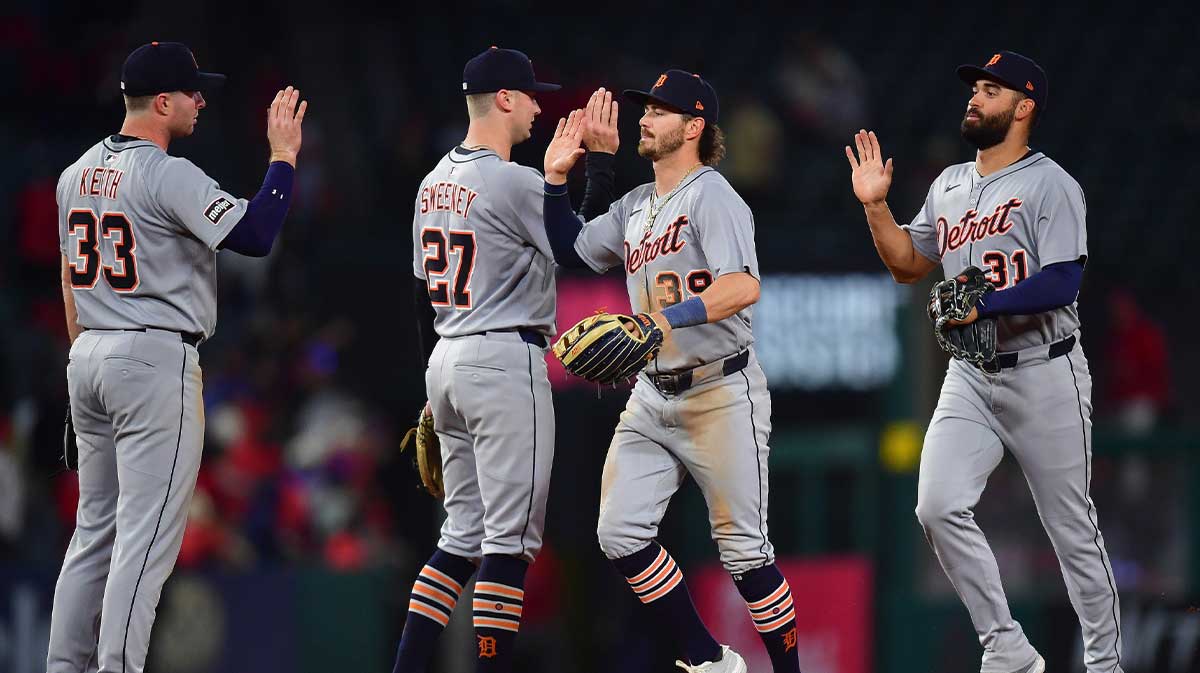 Detroit Tigers second base Colt Keith (33) shortstop Trey Sweeney (27) left fielder Zach McKinstry (39) and outfielder hitter Riley Greene (31) celebrate the victory at Angel Stadium.