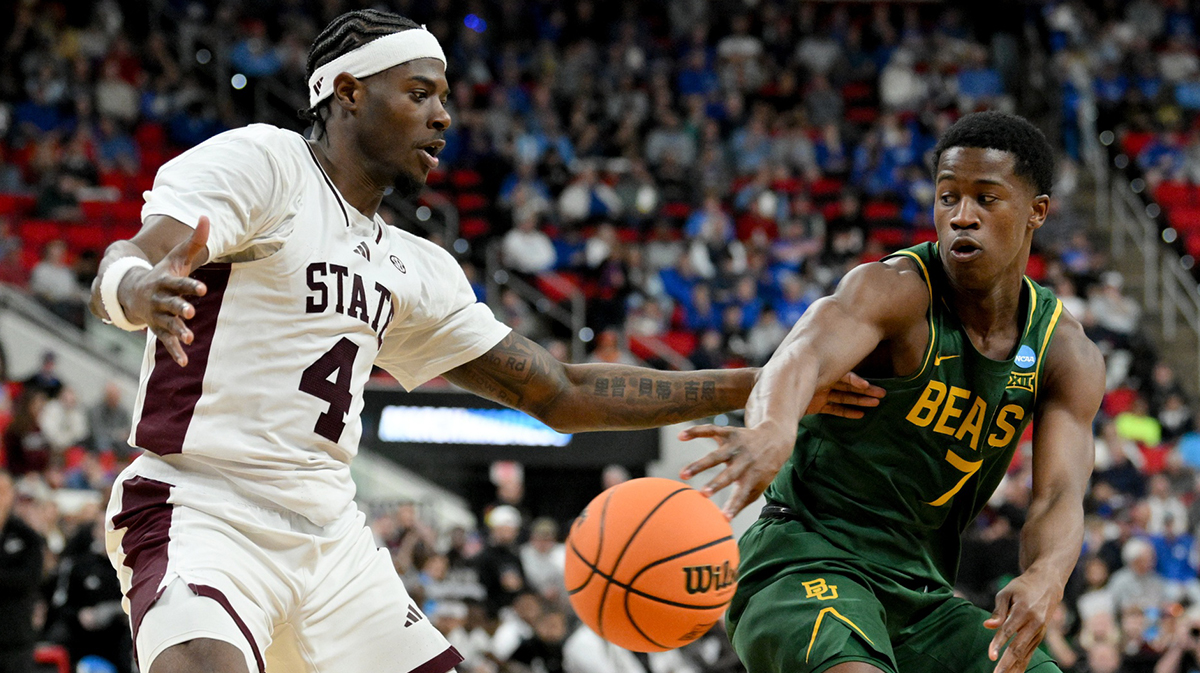 Baylor Bears guard VJ Edgecombe (7) passes the ball away from Mississippi State Bulldogs forward Cameron Matthews (4) during the second half in the first round of the NCAA Tournament at Lenovo Center.