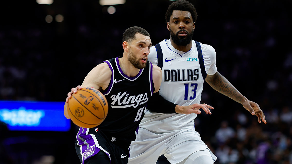 Sacramento Kings guard Zach LaVine (8) dribbles the ball against Dallas Mavericks forward Naji Marshall (13) during the fourth quarter at Golden 1 Center.