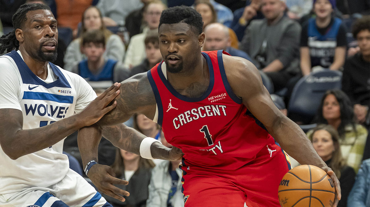 New Orleans Pelicans forward Zion Williamson (1) drives to the basket past Minnesota Timberwolves center Naz Reid (11) in the second half at Target Center.