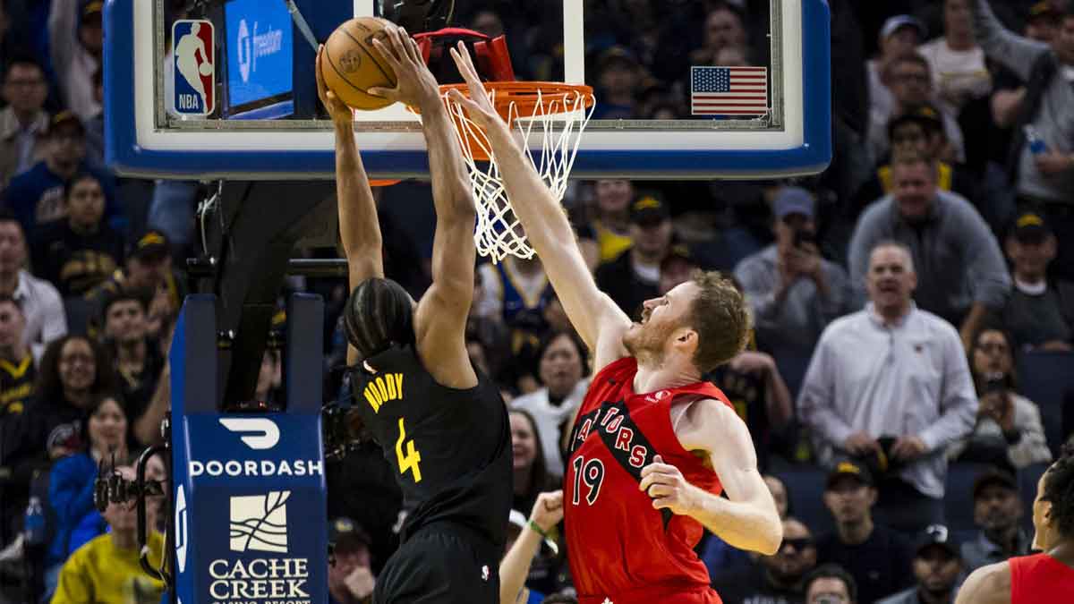 Golden State Warriors guard Moses Moody (4) shoots as Toronto Raptors center Jakob Poeltl (19) defends during the fourth quarter at Chase Center.