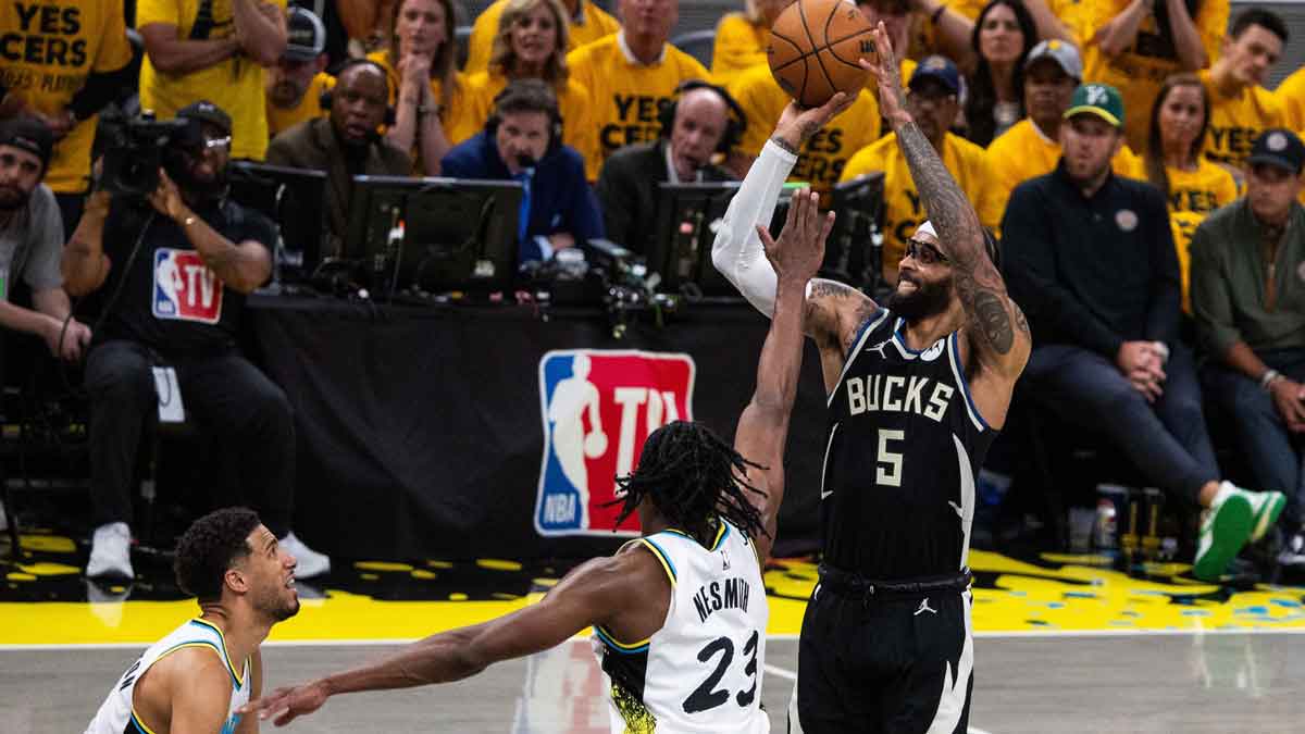 Milwaukee Bucks guard Gary Trent Jr. (5) shoots the ball while Indiana Pacers forward Aaron Nesmith (23) defends during game five of the first round for the 2024 NBA Playoffs at Gainbridge Fieldhouse.