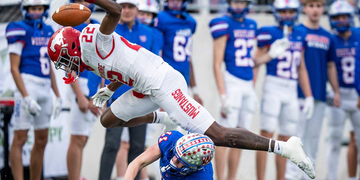 Westlake Chaparrals wide receiver Chase Bowen (11) and North Shore Mustangs free safety Chace Calicut (22) collide after the punt bounces in the first quarter as the Chaparrals take on the Mustangs in the Conference 6A Division 1 UIL State Playoff semi-final game at Legacy Stadium in Katy, Dec. 14, 2024.